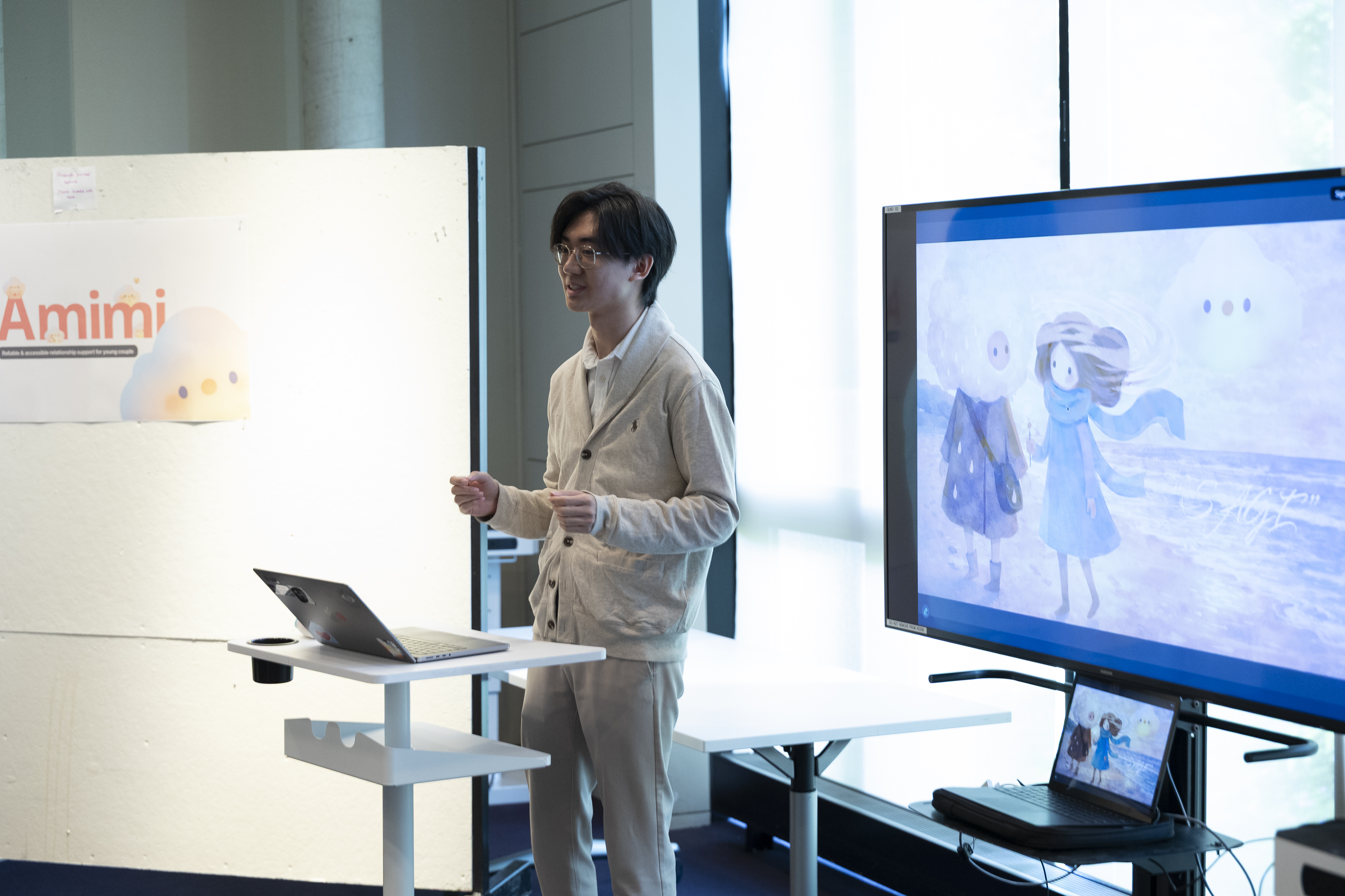 Presenting Amimi beside the project poster and a display of the Sage-inspired visual concept